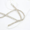 Pretty Polly Sash featuring a white lace headband adorned with silver beads against a Chicago