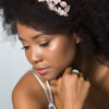Young woman with an afro, wearing a wedding headpiece featuring a Coraline Comb in Chicago