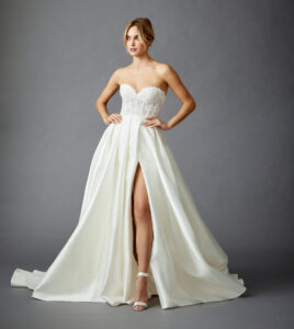 Allison Webb Ivy Wedding Dress with front slit and lace bodice from a Bridal Shop in Chicago, IL