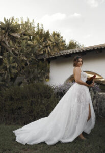 Dana Harel Kim wedding dress from a bridal shop in Chicago, IL. The model is pouting and holding rooster