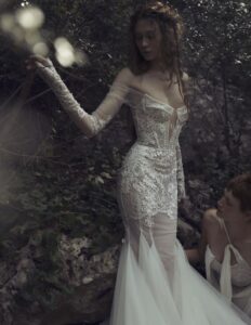 Kim Kassas Daphne Wedding Dress with applique, corset, lace, sheer skirt, and mermaid train available at a bridal shop in Chicago, IL