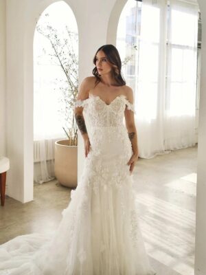 Martina Liana 1612 Wedding Dress at a bridal shop in Chicago, IL with off shoulder straps and lots of little details