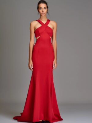 Evening wear gown with a halter neckline and open back. Fit and flare silhouette. 