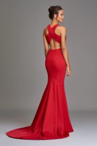 Evening wear gown with a halter neckline and open back. Fit and flare silhouette. 