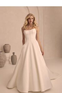 Strapless gown in satin with princess seams.