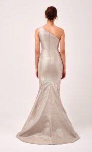 One-shoulder evening gown with cascading ruffle.