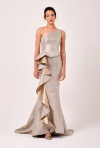 One-shoulder evening gown with cascading ruffle.