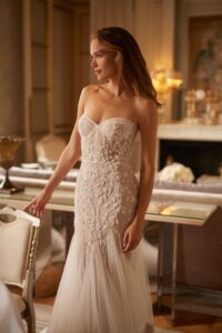 Fit and flare corset wedding gown with beading.