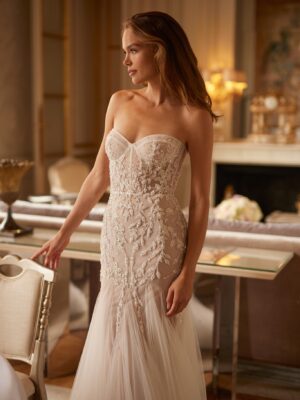 Fit and flare corset wedding gown with beading.