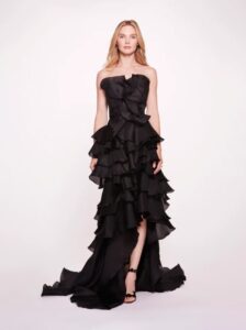 Evening wear gown with floral ruffle detailing throughout the gown and strapless neckline.