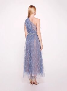 Tea length evening wear gown with one shoulder strap and ostrich feathers.