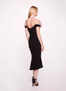 Midi dress with ruffle detailing along the neckline. Off-shoulder sleeves with an open back.