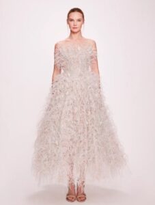 Strapless tea length ballgown dress with ostrich and duck feathers.