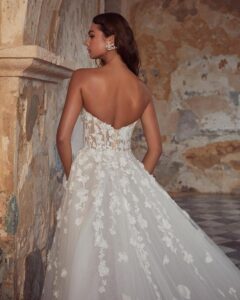 A-line 3D floral wedding gown with sleeves.