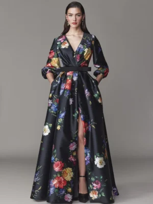 Long sleeve dark floral gown with deep v-neckline and high slit. Available at Mira Couture in Chicago, IL.