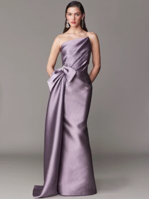 Fit and flare evening gown with asymmetrical bow.