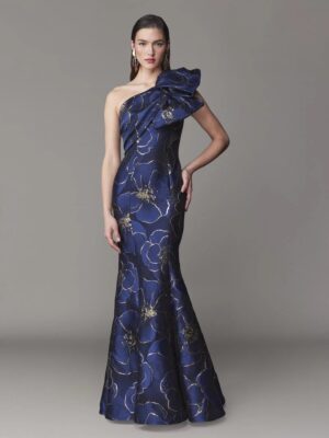 One shoulder evening gown with front draping and bow and a fit and flare skirt silhouette.