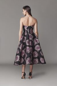 Strapless evening dress, full skirt silhouette with crinoline and floral pattern. 