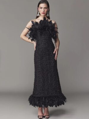 Strapless evening gown with feathers on bodice and hem.