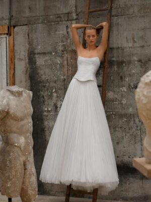 Soft tulle a-line with a drop waist corset.