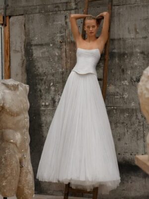 Soft tulle a-line with a drop waist corset.