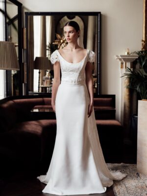 woman standing in Sleek clean and simple wedding gown skirt