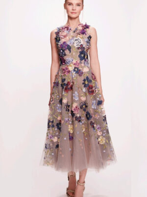 A beautiful tulle midi dress featuring a jewel neckline with 3 dimensional floral detailing and a pleated A-line skirt