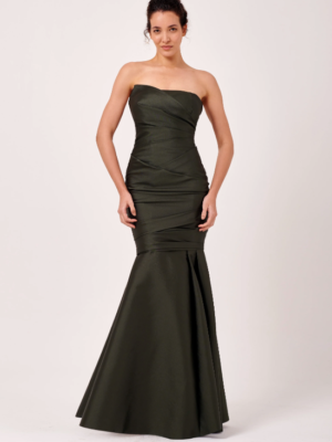 This stunning full-length formal gown is sure to turn heads. Crafted from luxurious mikado woven fabric, it combines elegance and sophistication with every step. The rich texture of the fabric enhances its graceful silhouette, making it the perfect choice for a memorable evening. 