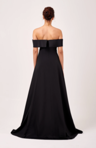 This gorgeous formal dress is composed of a woven mikado fabric. It is fitted around the bodice and skirt and features