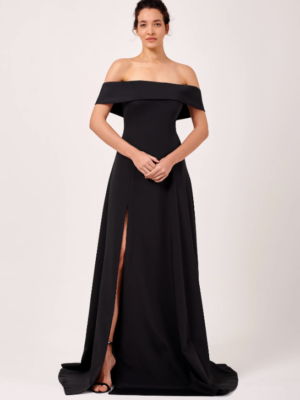 This gorgeous formal dress is composed of a woven mikado fabric. It is fitted around the bodice and skirt and features