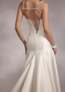 pearl-strapped trumpet dress with draped pearl necklace style top and lace-up back.