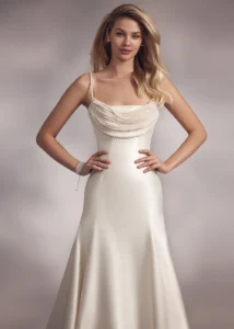 pearl-strapped trumpet dress with draped pearl necklace style top and lace-up back.