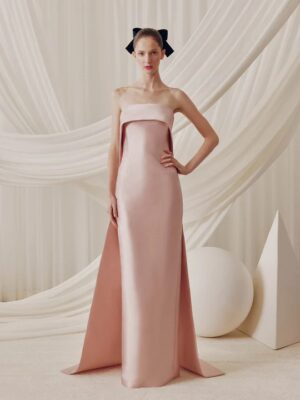 Elegant column fitted dress with a fold over neckline and detachable train.