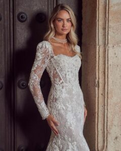 Lace fitted long sleeve wedding gown.