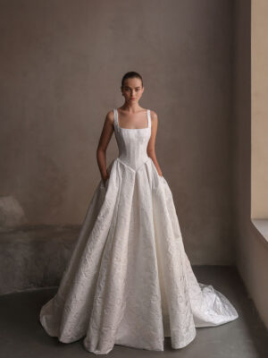 Square neck jacquard wedding gown featuring a basque waistline.