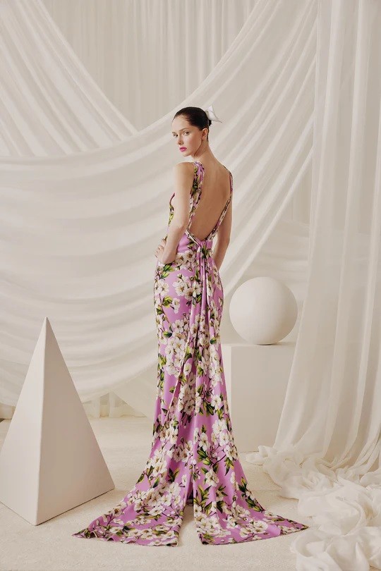 A model wearing 6838 by Audrey and Brooks, poses against a white backdrop in Chicago.