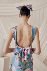Back view of a model wearing 6830 by Frascara, a blue floral evening dress in Chicago.