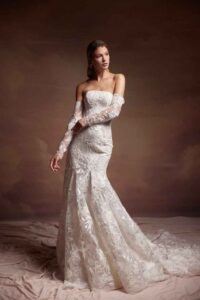 A long sleeve lace wedding dress featuring an elegant long train in Chicago