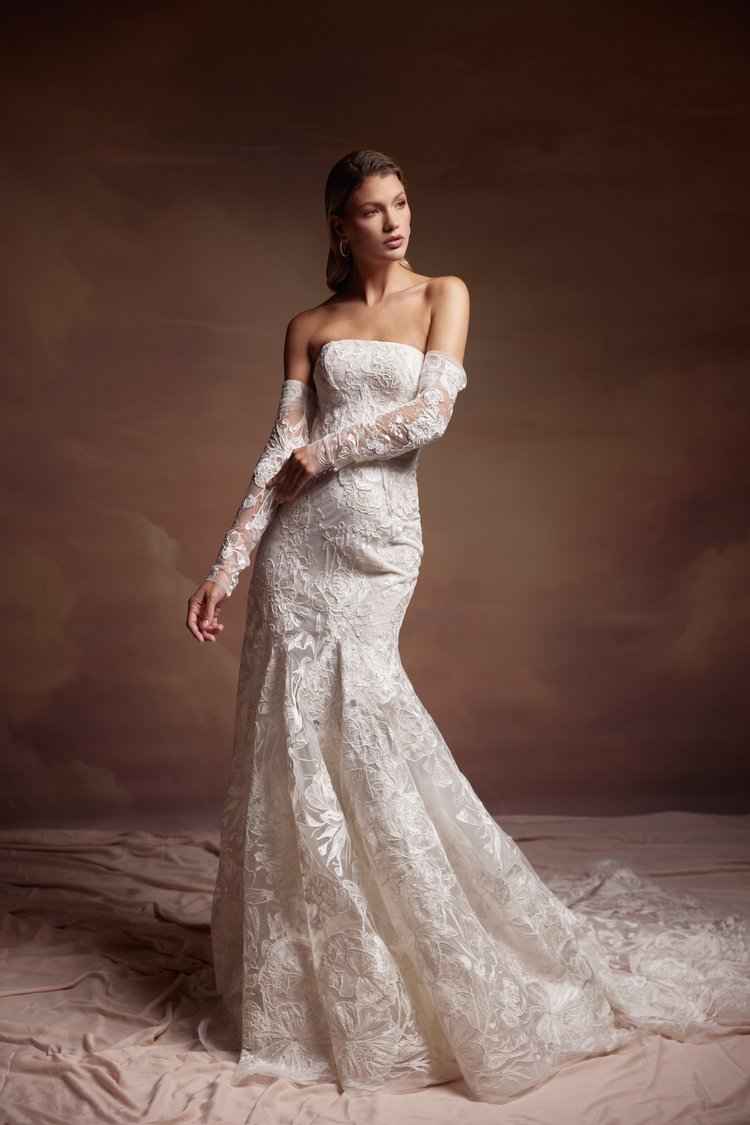 A long sleeve lace wedding dress featuring an elegant long train in Chicago