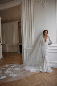 Olivia by Eisen Stein, a romantic fit & flare gown adorned with romantic floral lace in Chicago, IL.