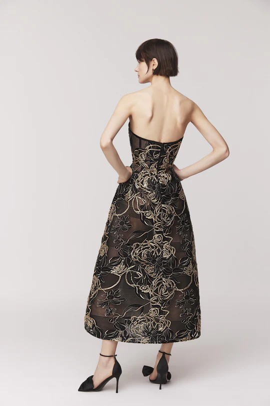 Strapless midi dress Full skirt silhouette with corseted crinoline Exposed back zipper Satin lined