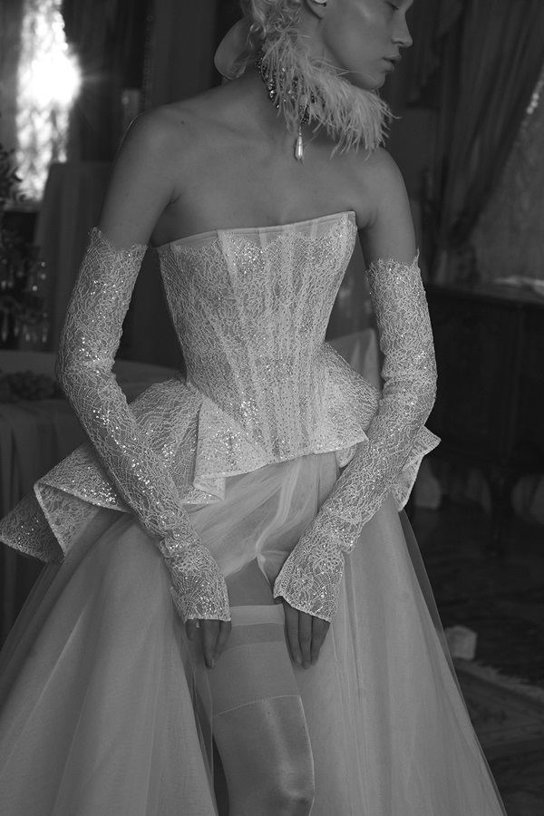 A bride shows the dramatic slit of her wedding dress