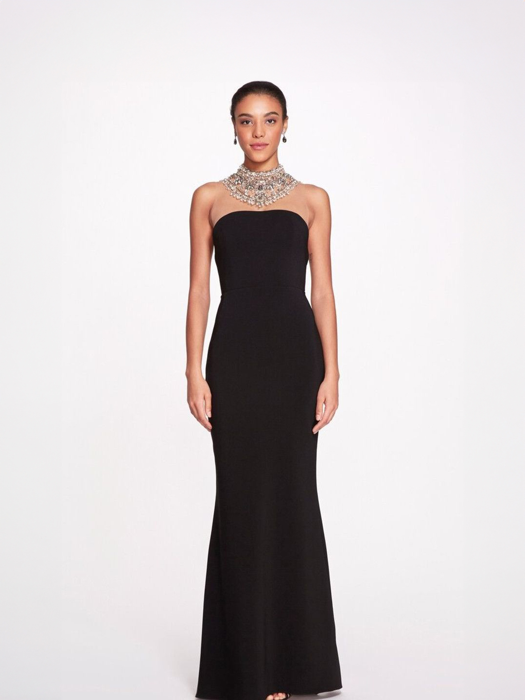 A model wearing a black strapless dress for the Marchesa Pre Sale at Mira Couture in Chicago