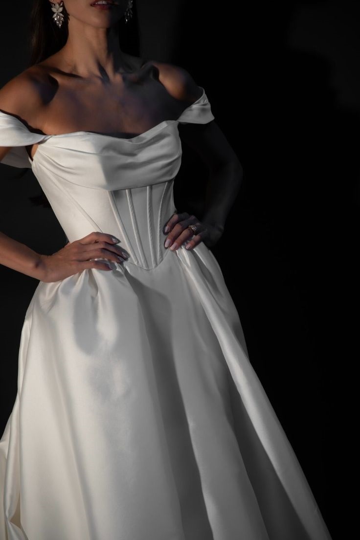 Clean Basque waist ball gown with draped bodice and pleated detailing available at Mira Couture in Chicago