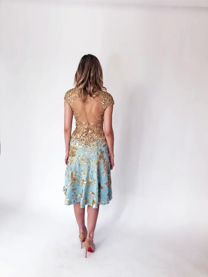 Back view of gold and blue cocktail dress in Chicago